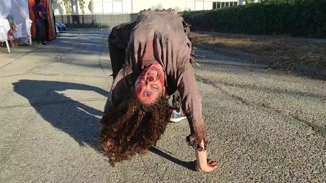 Michela Melone backbend walk as a scare actor, AMC Shudder