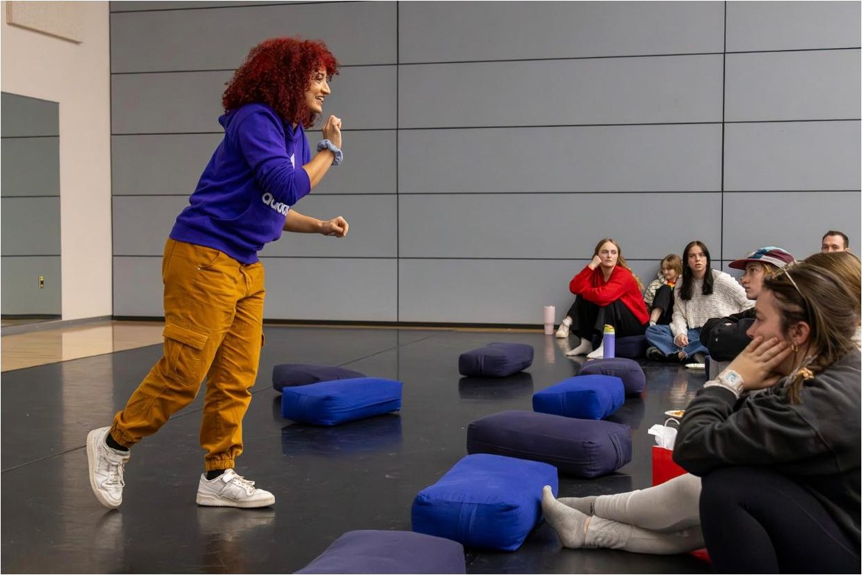 Michela Melone guiding dance students as a guest artist